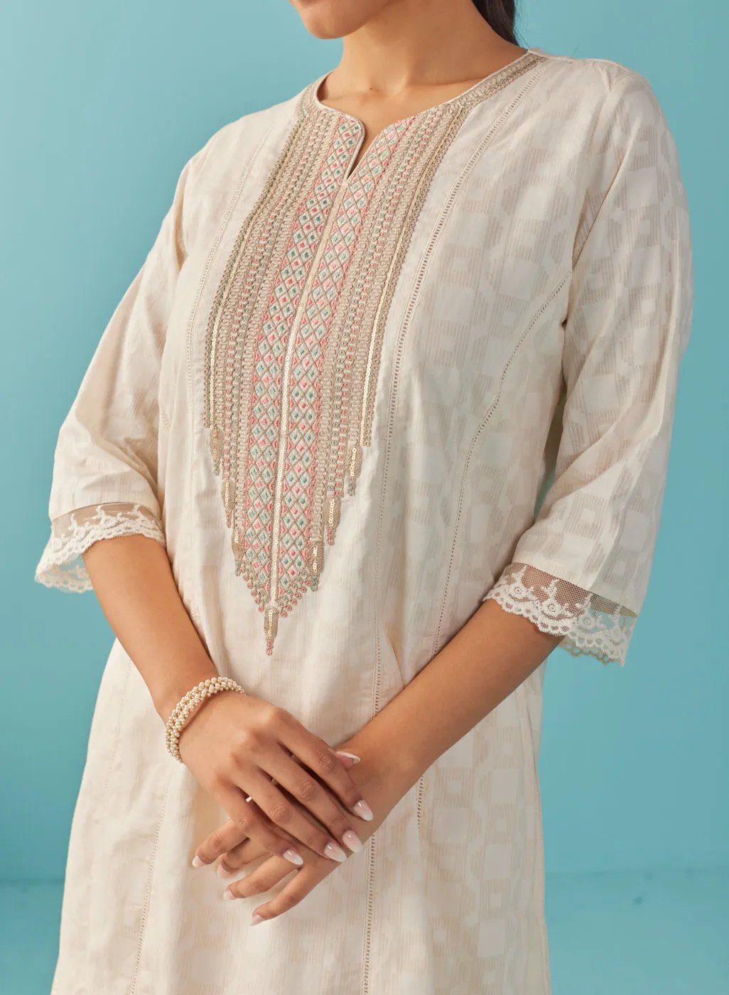 Ivory Textured Kurta set with Multicolor Embroidery